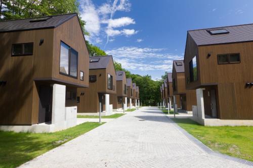 a row of houses on a street at Gakuto Villas in Hakuba