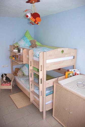 a bedroom with a bunk bed with two bunk beds at Ferienbauernhof Herrmann in Herrieden