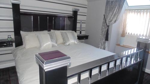 Katil atau katil-katil dalam bilik di Westmore Bed & Breakfast