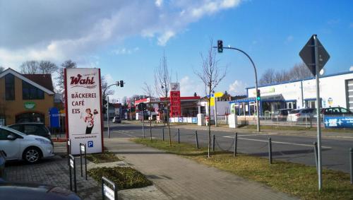 a sign on the side of a street next to a road at Ferienappartements Am Weinberg in Bestensee