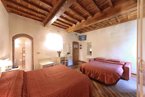Postel nebo postele na pokoji v ubytování Hotel Villa San Michele