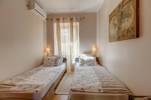 Postel nebo postele na pokoji v ubytování Hotel Sansegus