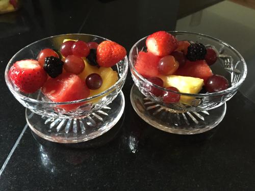 two glass bowls filled with fruit on a table at Fir Tree Barn in Pollington