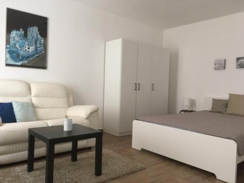 Łóżko lub łóżka w pokoju w obiekcie KAF Apartment