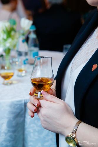 a woman holding a wine glass in her hands at Hotel Select in Iaşi