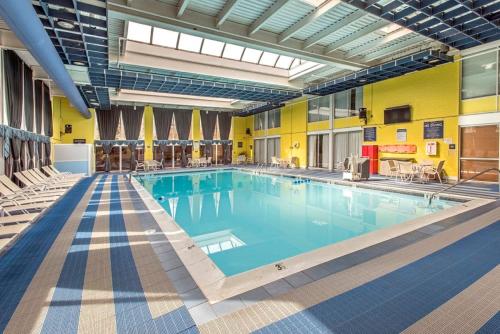 a large swimming pool in a hotel room at Days Hotel by Wyndham Allentown Airport / Lehigh Valley in Allentown