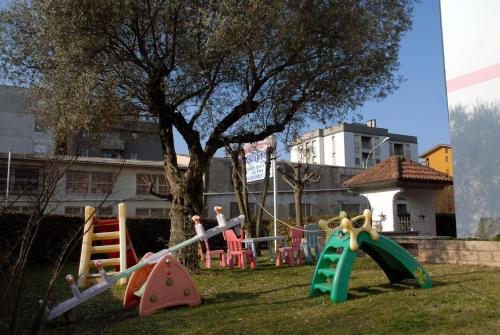 a group of childrens playground equipment in a yard at Hotel Ristorante Il Calipso by Mago in Robecchetto con Induno