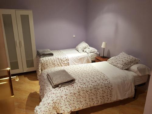 Cama ou camas em um quarto em Pradera de San Isidro