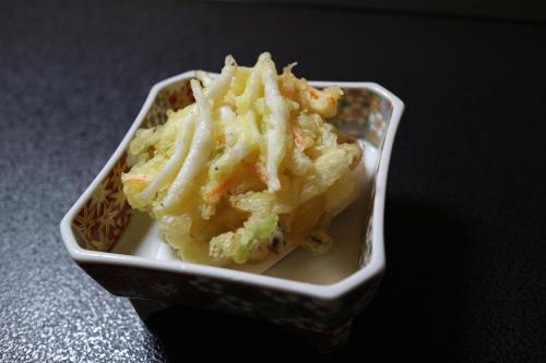 a small container of food sitting on a table at Jizokan Matsuya Ryokan in Nagano