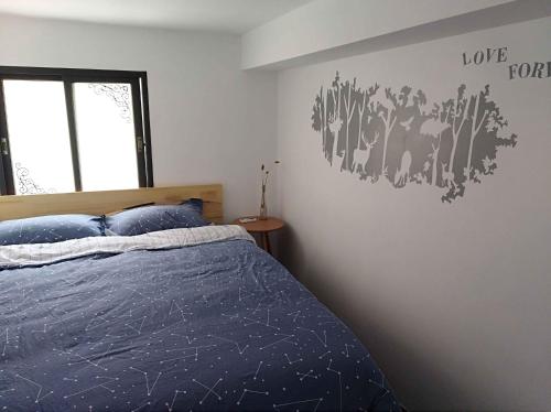 Postel nebo postele na pokoji v ubytování Lin Jiang Apartment
