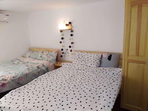 Postel nebo postele na pokoji v ubytování Lin Jiang Apartment