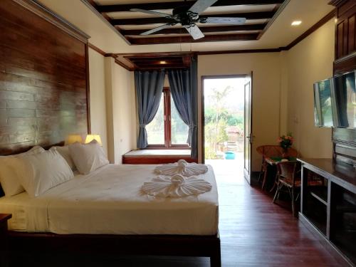Кровать или кровати в номере Sengahloune Resort