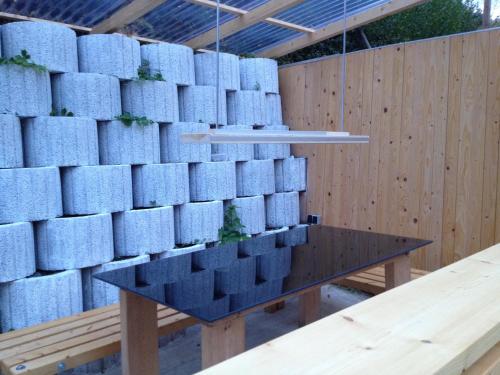 a wall of stacked blue boxes on a table at Direkt am Main in Karlstadt