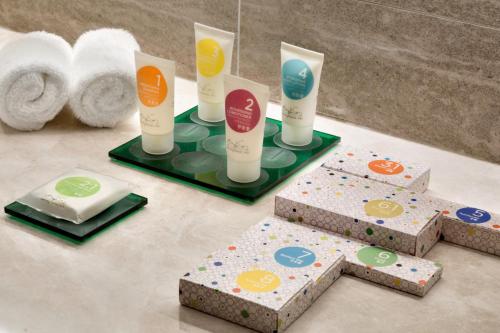a bathroom with threeentalental products on a counter at Hyatt Place Zhuhai Jinshi in Zhuhai