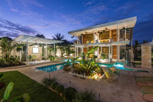 an image of a house with a swimming pool at Umami Hotel - Adults Only in Puerto Viejo
