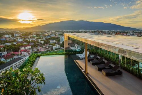 a view from the roof of a building with a pool at The Astra Chang Khlan Chiang Mai in Chiang Mai