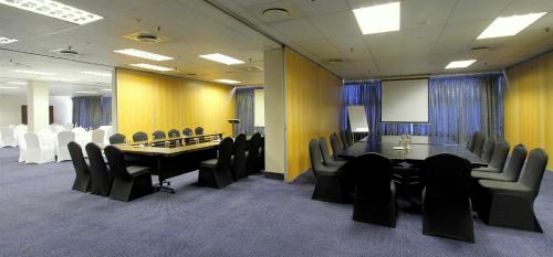 a conference room with a long table and chairs at Coastlands Durban Self Catering Holiday Apartments in Durban