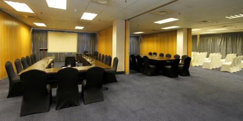 a conference room with a long table and chairs at Coastlands Durban Self Catering Holiday Apartments in Durban