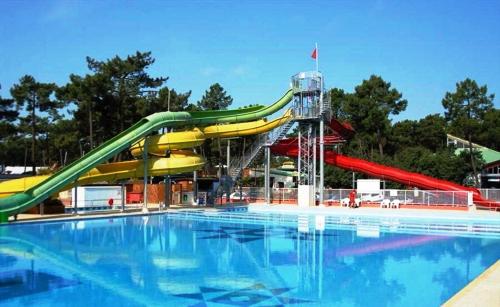 a water slide in a pool at a water park at Bonne Anse Plage in La Palmyre