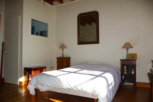 En eller flere senge i et værelse på Angel Services - Le Port