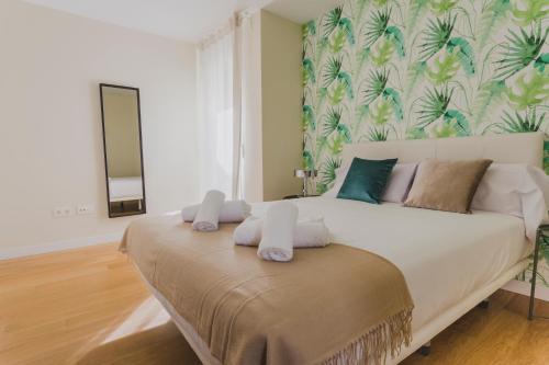 Katil atau katil-katil dalam bilik di HQ Rooms Apartments San Vicente