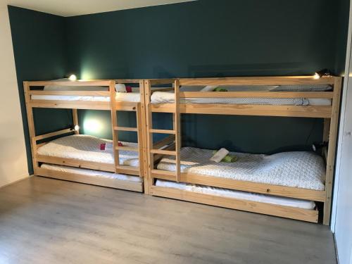 Μία ή περισσότερες κουκέτες σε δωμάτιο στο Angel Services - La Planche