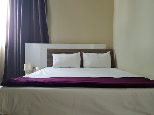 Cama ou camas em um quarto em Sugar Reef Apartment