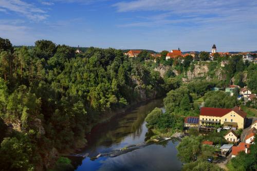 an aerial view of a river in a town at Hotel Panská in Bechyně