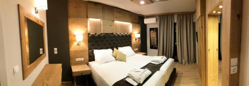 Ένα ή περισσότερα κρεβάτια σε δωμάτιο στο Elmi Beach Hotel & Suites