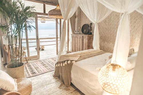 Postel nebo postele na pokoji v ubytování Dreamsea Bali