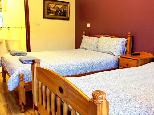 Ein Bett oder Betten in einem Zimmer der Unterkunft The Oasis Hotel