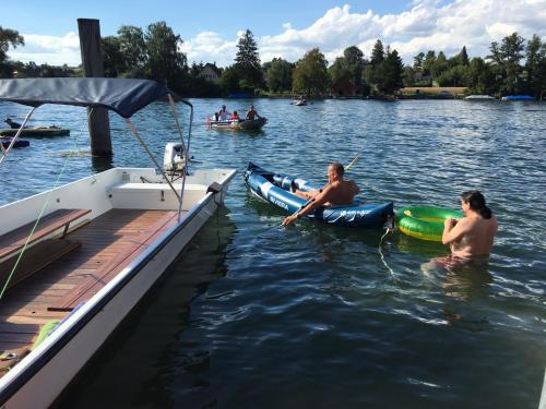 a group of people in the water on a boat at Alpenpanorama am Hochrhein in Gailingen