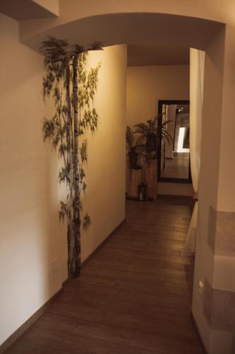a hallway with trees painted on the wall at Penzion Štybar in Stříbro