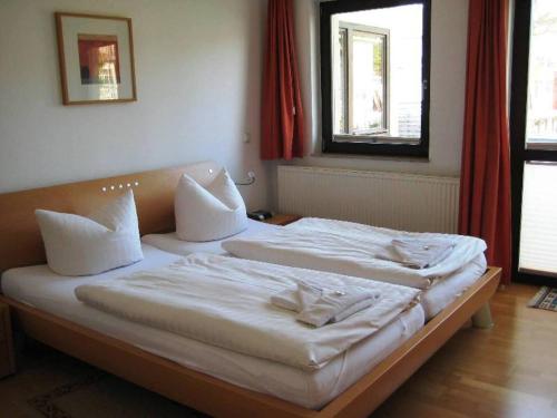 Ένα ή περισσότερα κρεβάτια σε δωμάτιο στο Gartenhaus Villa Sanssouci