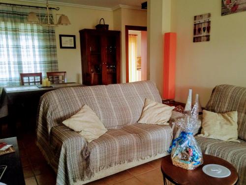 a living room with a couch and a table at Al-Andalus Thalassa Home Star in Vera