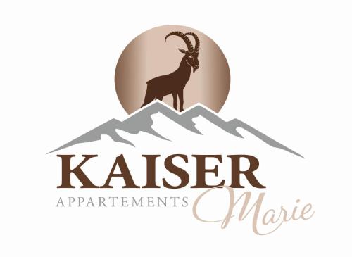 a goat on top of a mountain logo at Kaiserappartements-Marie in Ellmau