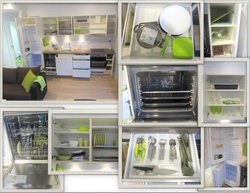 a kitchen with an open refrigerator with a kitchen utensils at Scandian Apartments - City Hub Tallinn in Tallinn