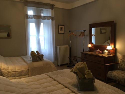 Postel nebo postele na pokoji v ubytování B&B Chez Hubert