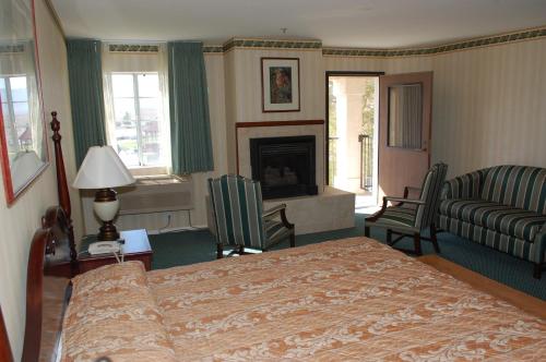 a hotel room with a bed and a fireplace at Longstreet Inn & Casino in Amargosa Valley