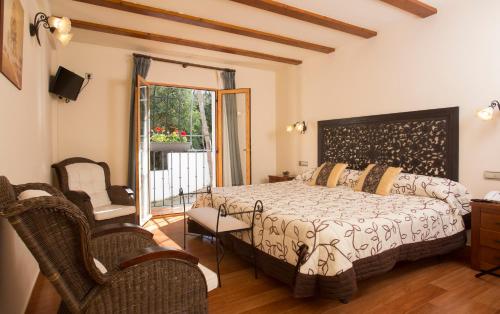 Ένα ή περισσότερα κρεβάτια σε δωμάτιο στο Hotel Tossal d'Altea