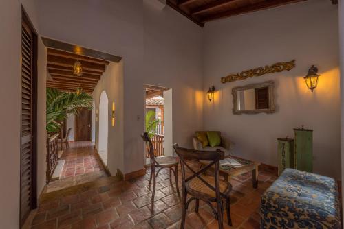 Postel nebo postele na pokoji v ubytování Getsemani Cartagena Hotel