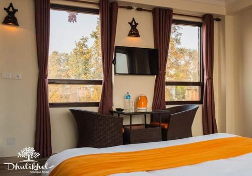 מיטה או מיטות בחדר ב-Dhulikhel boutique hotel