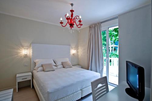 Säng eller sängar i ett rum på Hotel Mediterraneo Club Benessere