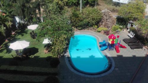 an overhead view of a swimming pool in a yard at Euro Star Hotel in Katunayake