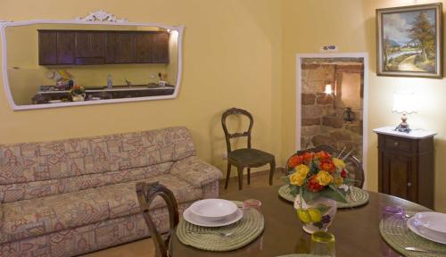 a living room with a couch and a table at Casa Aurora in Assisi