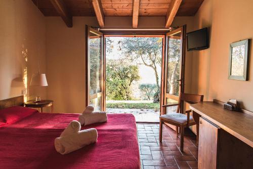 a bedroom with a bed with a teddy bear on it at Corte San Mattia in Verona