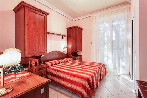 Letto o letti in una camera di Hotel Villa Pina