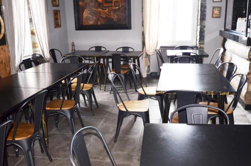 a row of tables and chairs in a restaurant at Porta del Parco in Camogli