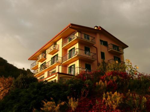 a building on the side of a hill at Hotel La Vigna in Moneglia