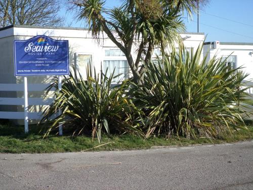 a sign for a hotel on the side of a street at Lighthouse Chalet in Lowestoft